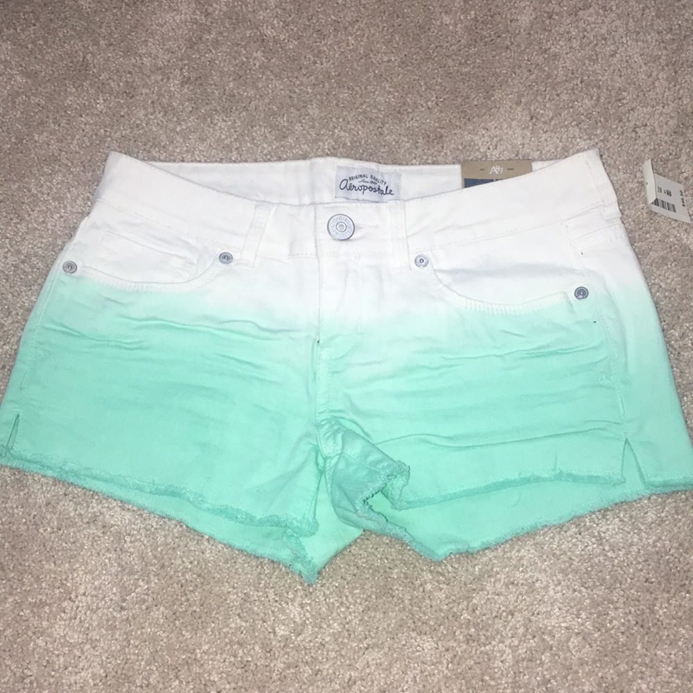 White and teal ombre jean shorts